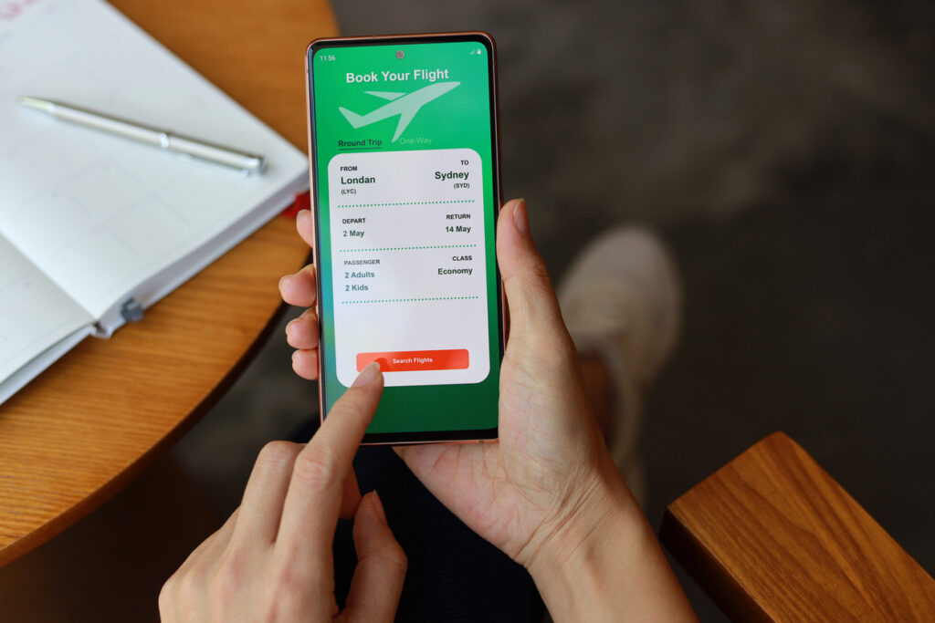 Traveler searching flight awards on smartphone