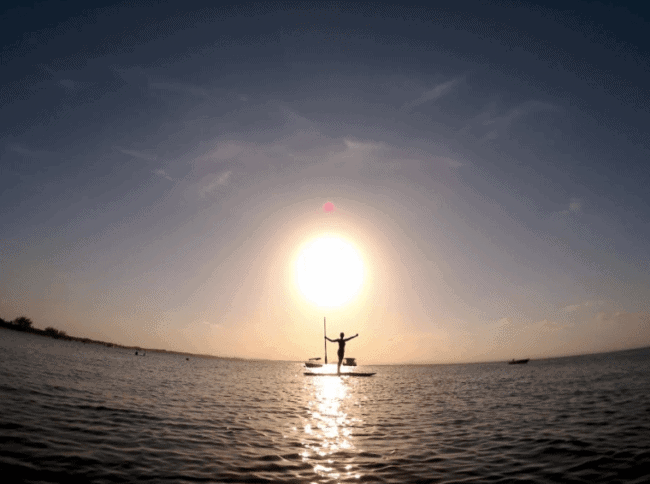 Me stand up paddle boarding at Ponta do Mutá